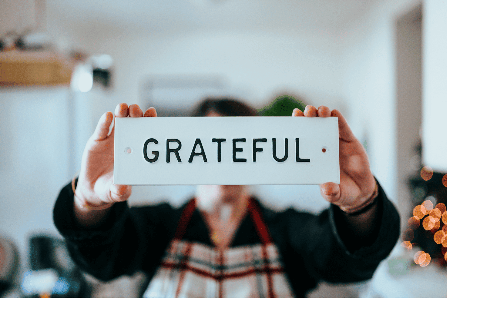 Grateful woman holding grateful sign
